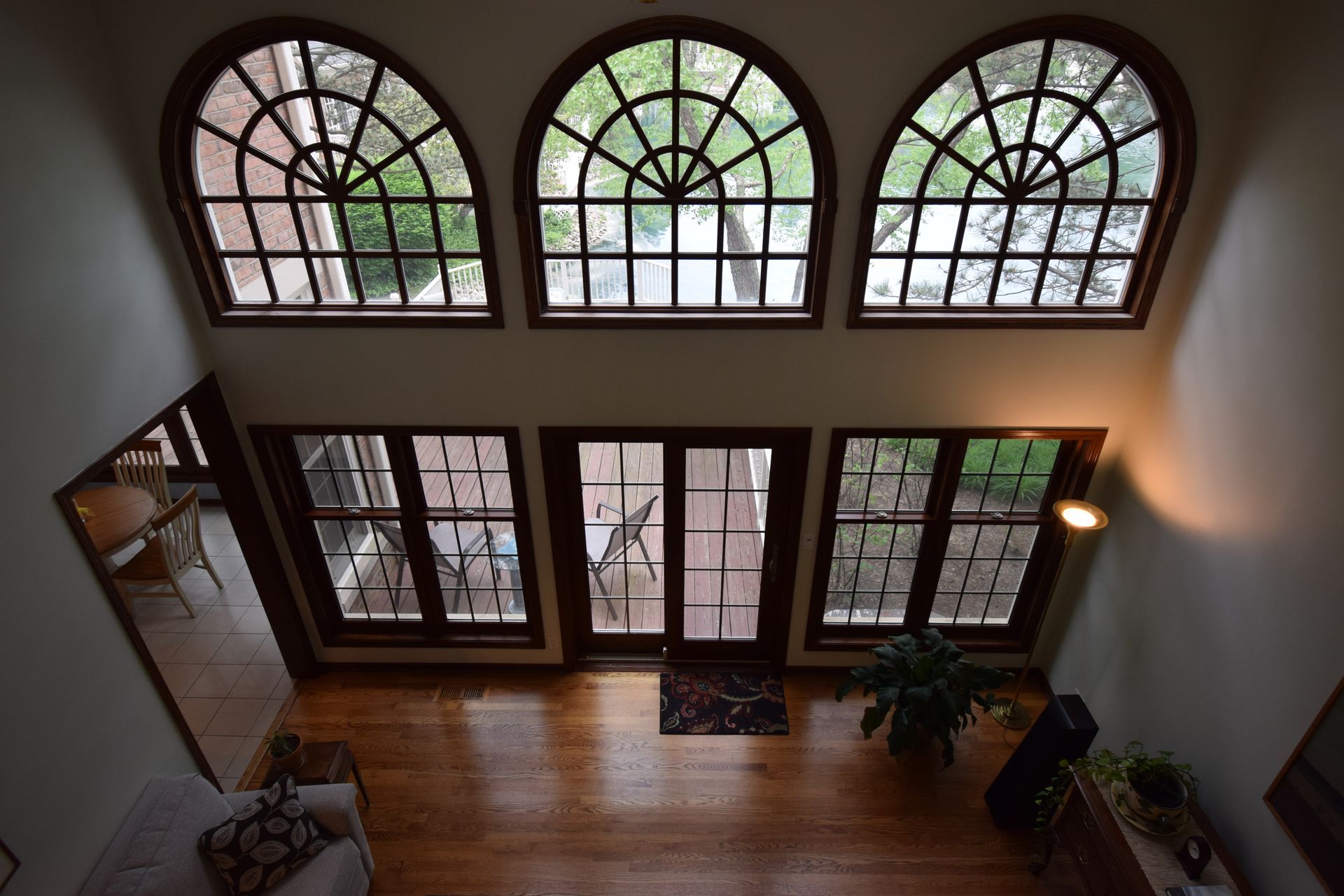 An aerial view of a living room with arched windows