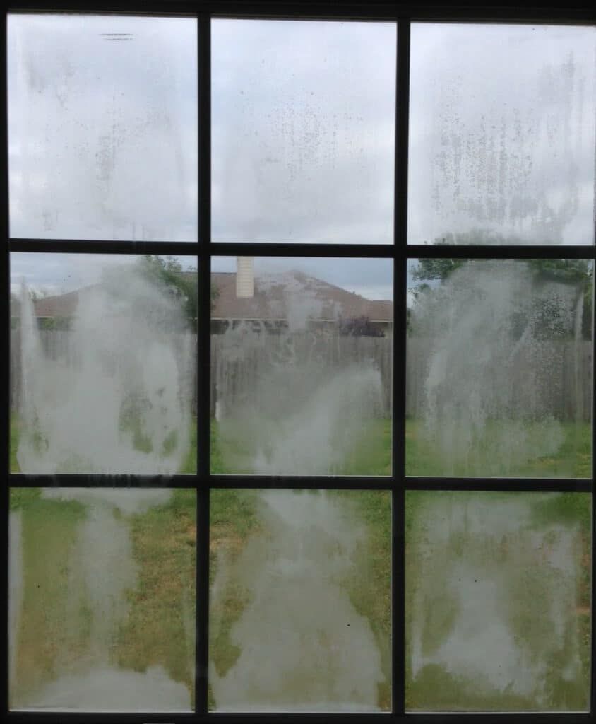 A window with a lot of condensation on it