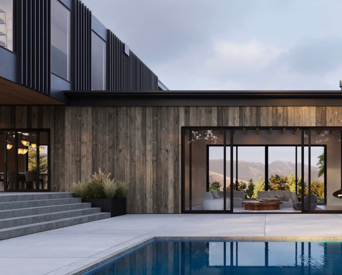 Modern house patio with pool, concrete steps, and floor-to-ceiling glass doors at dusk