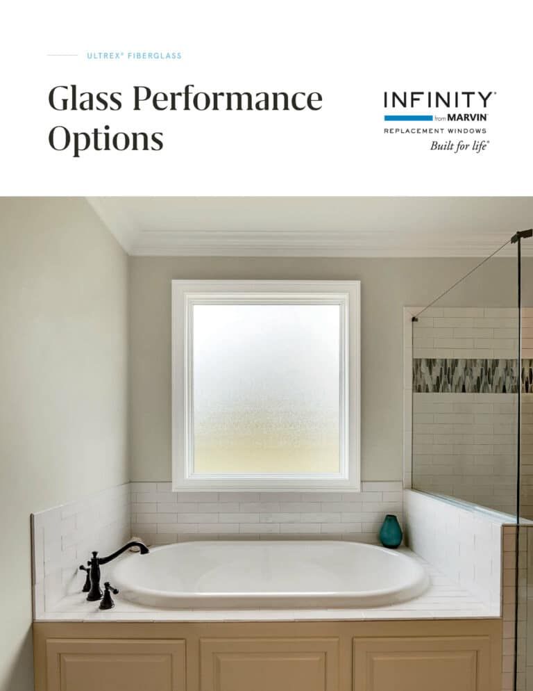 A bathroom with a bathtub and a window.