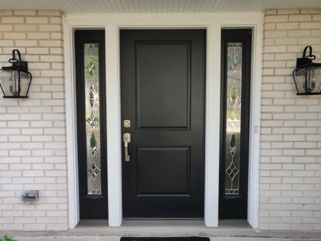 custom black front door with white brick wall