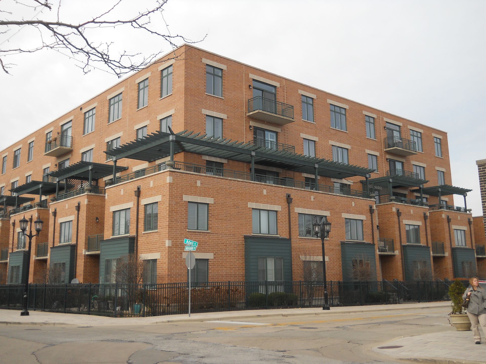 A large brick building with a lot of windows and balconies