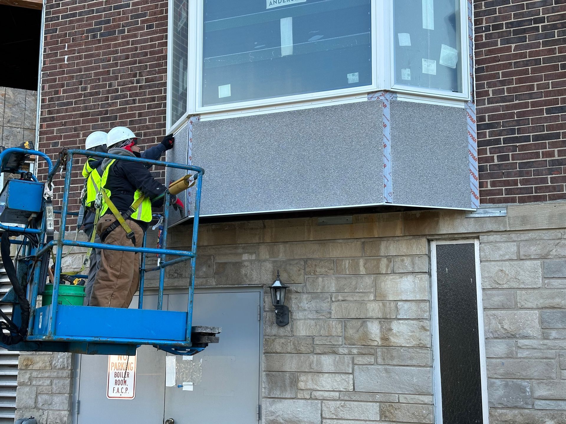 A kitchen with a large island and wooden beams on the ceiling