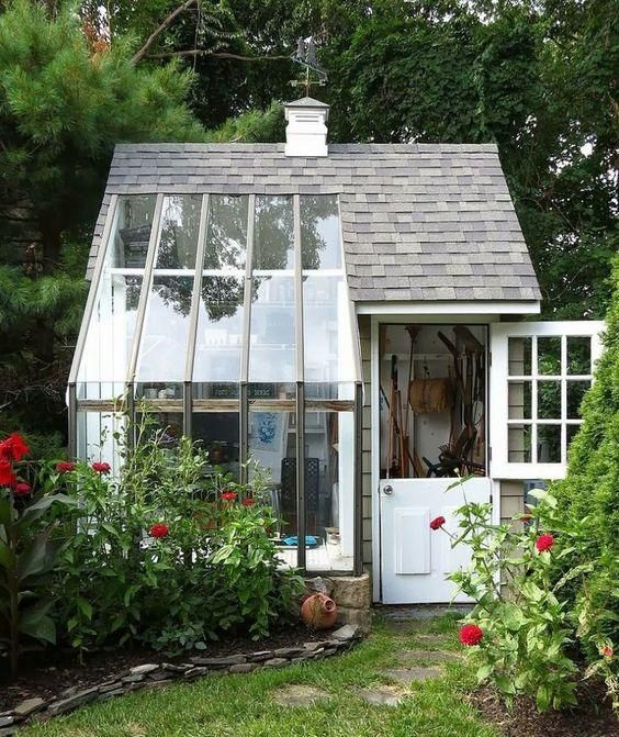 A small house with a greenhouse attached to it