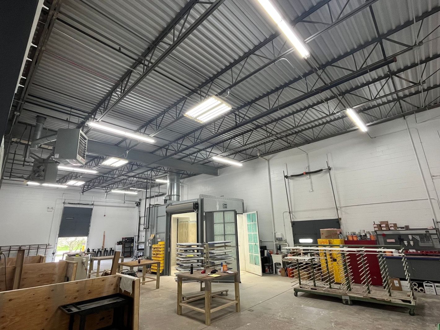 A large warehouse with a ceiling that is covered in metal.