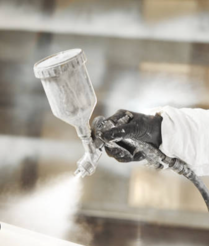 Custom finishing taking place on a window.