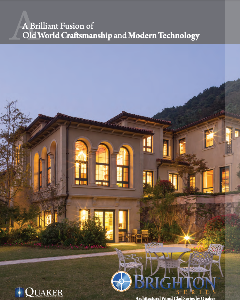 A large house with a lot of windows and chairs in front of it