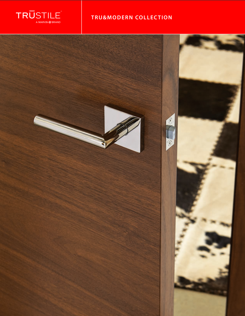 A close up of a door handle on a wooden door