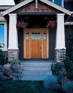 A house with a porch and a wooden door