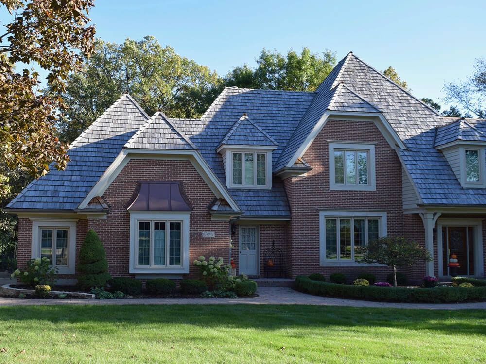 A large brick house with a slate roof