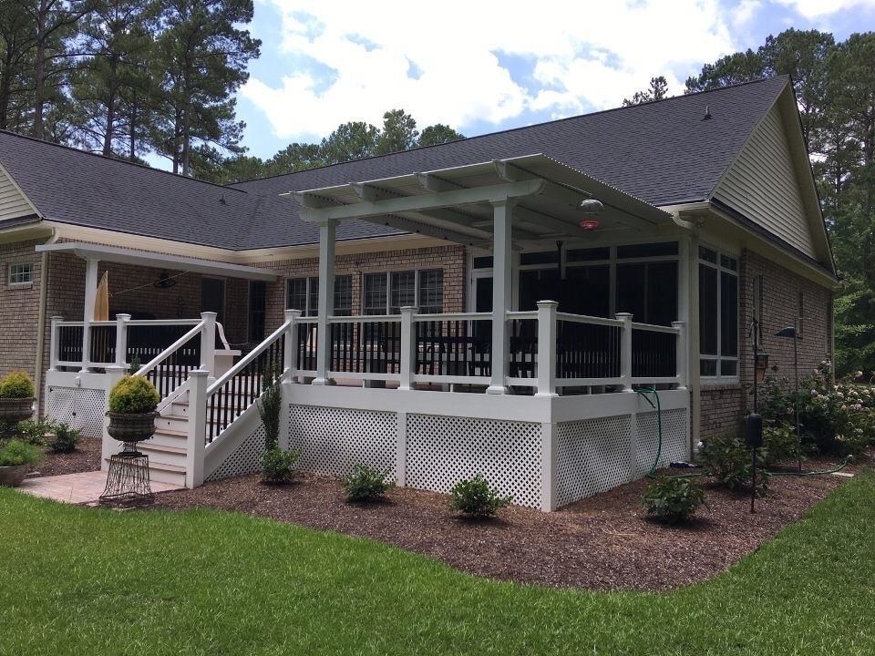 A house with a pergola porch and stairs