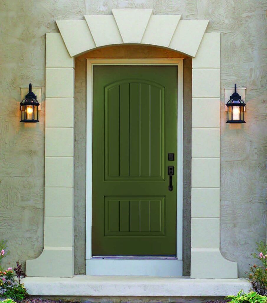 A green door is surrounded by white pillars and lanterns