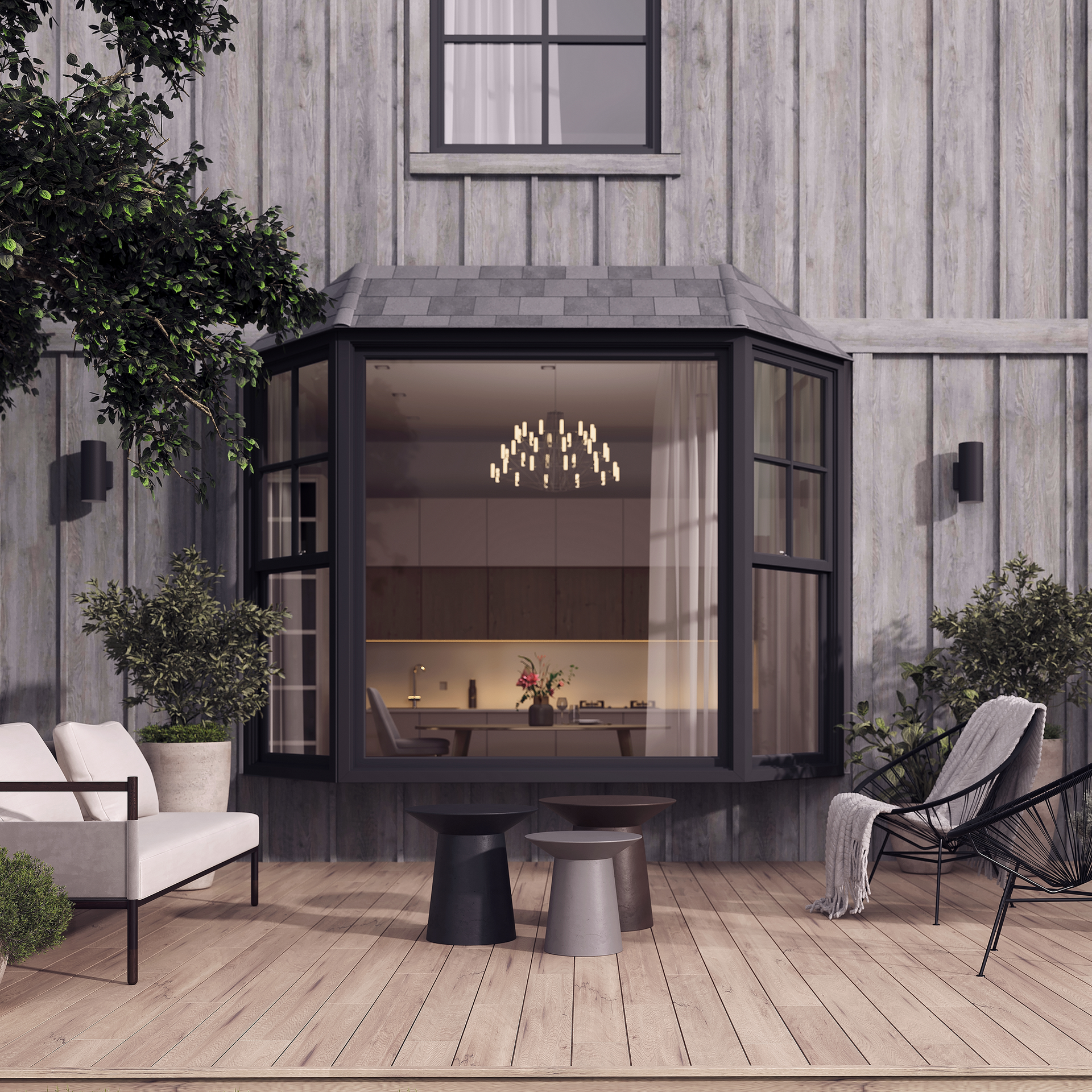 A patio with a couch and chairs and a large window