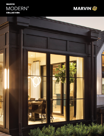 A modern wooden house with a black garage door