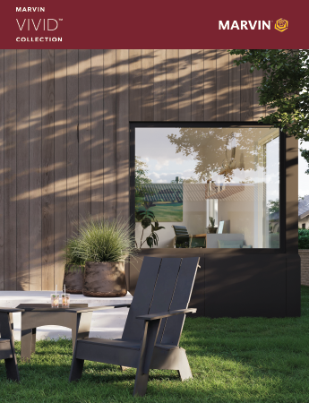 A modern wooden house with a black garage door