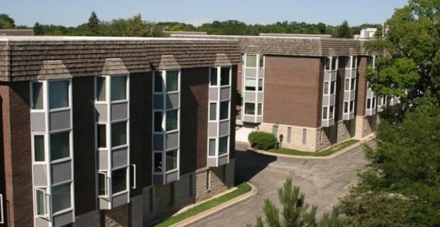 A large apartment building with a lot of windows