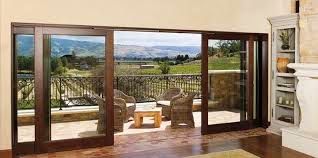 A living room with sliding glass doors leading to a balcony.