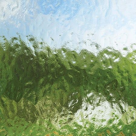 A painting of a green field with a blue sky in the background