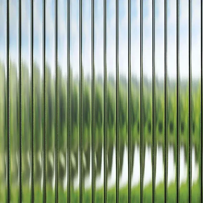 A blurred image of a fence with trees in the background.