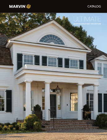 A large white house with black shutters on the windows