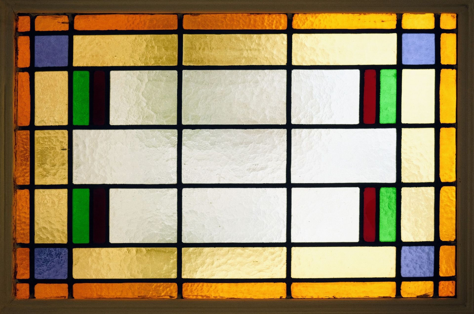 A stained glass window with a grid of squares on it