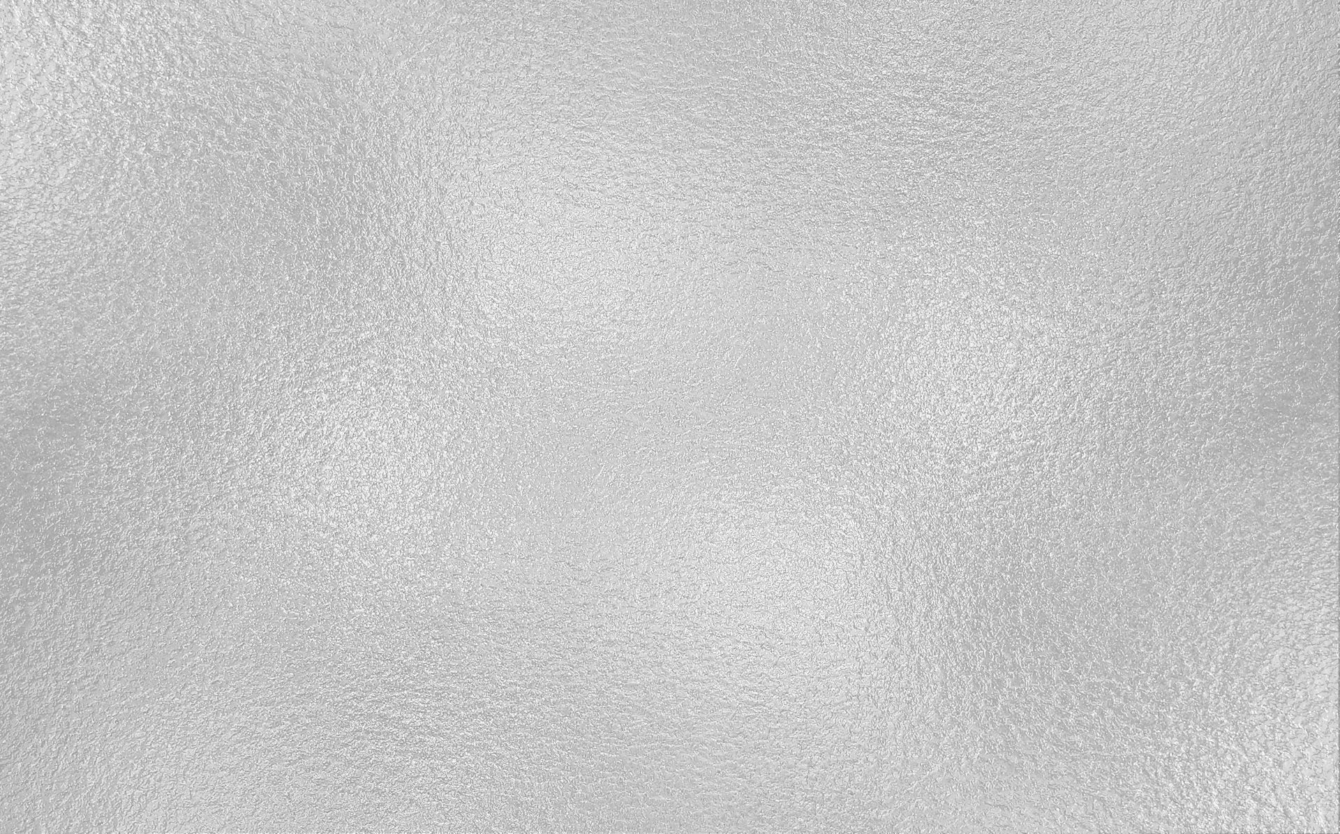 A close up of a white surface with a grainy texture.