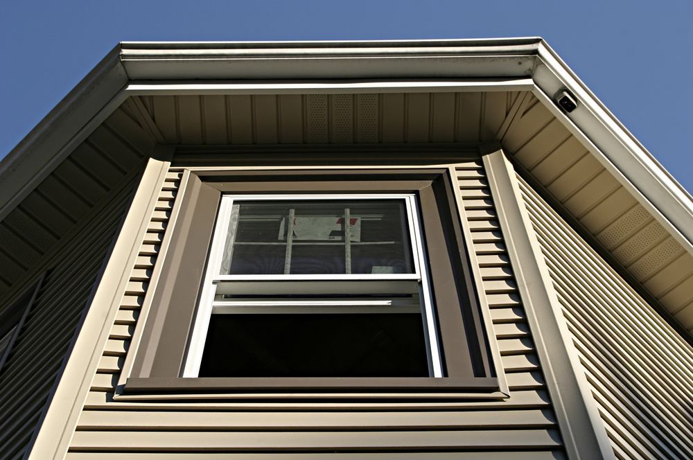 Replacing windows and siding of a home.