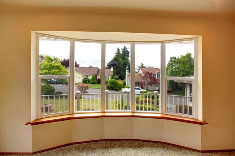 There is a large bay window in the middle of the room.