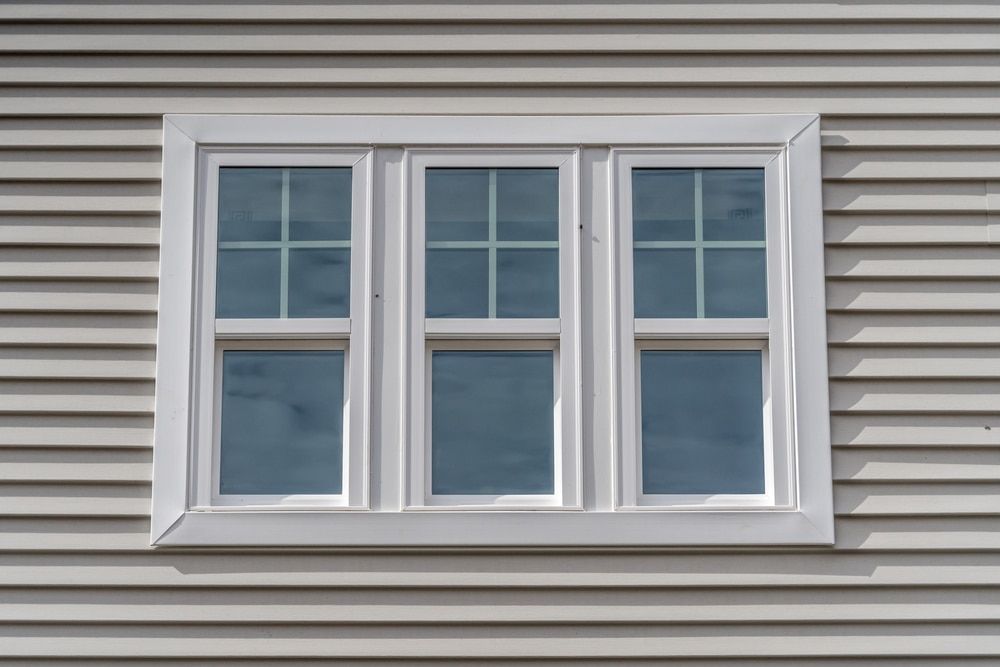 A close up of a window on the side of a house.