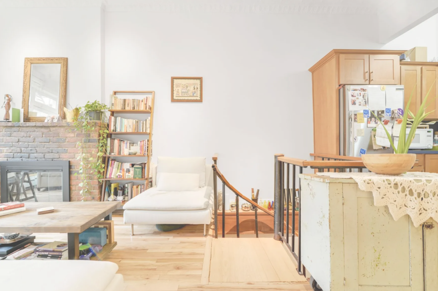 A living room filled with furniture and a fireplace.
