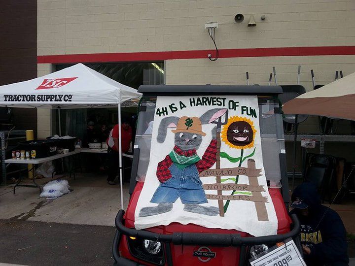 A red golf cart with a sign that says 