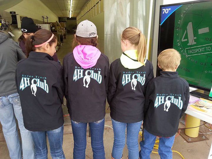 A group of children wearing 4h club jackets