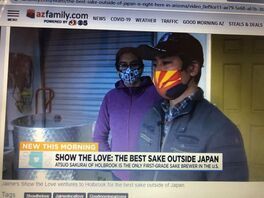 A man and a woman wearing face masks are standing next to each other.
