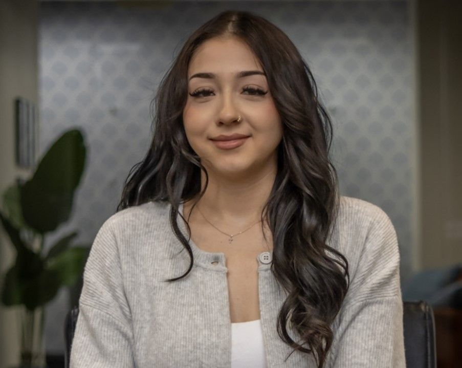 A close up of a white wall with a brush stroke pattern.