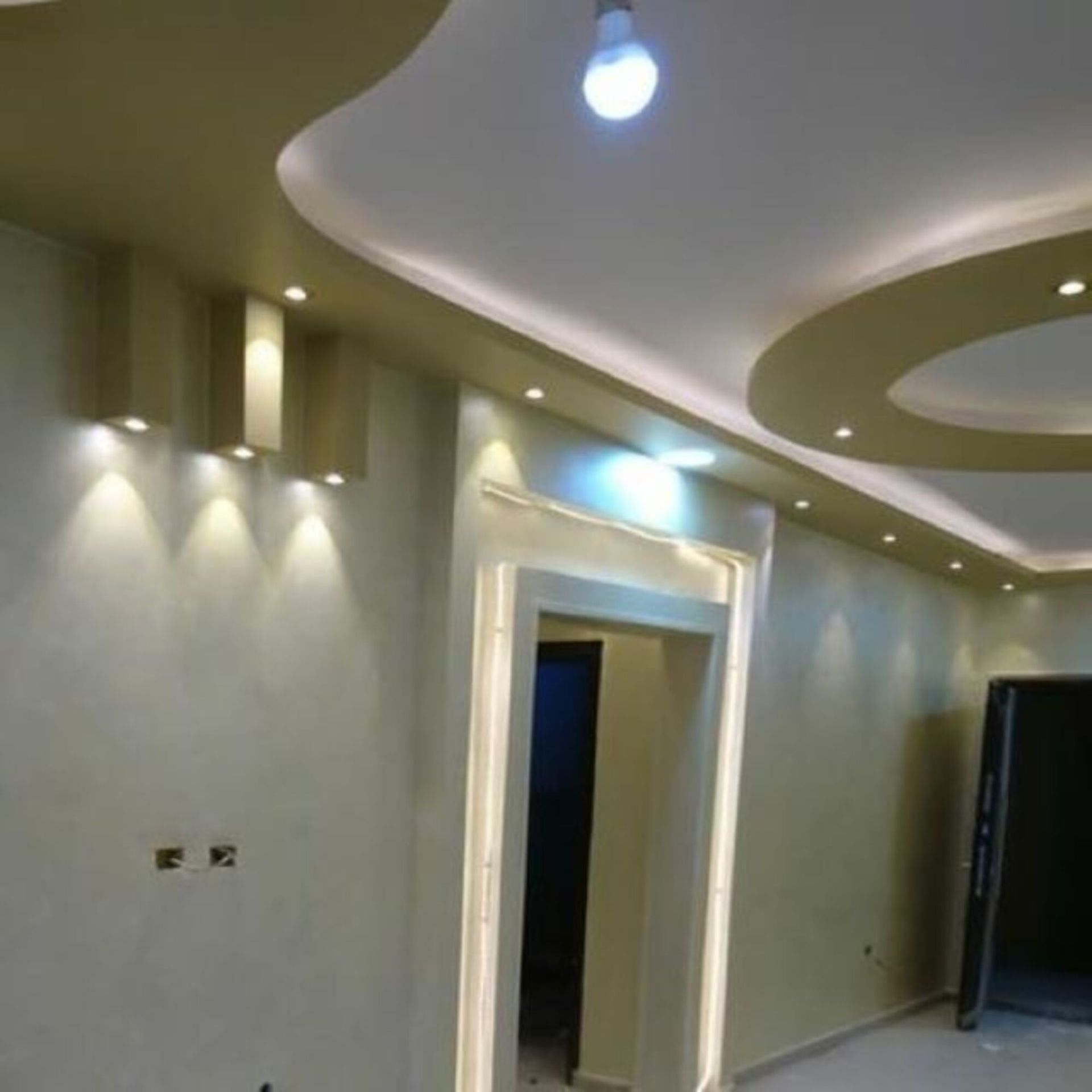 A room with a ceiling that has a light on it