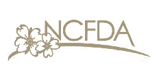 NCFDA logo with flowers and a curved line.