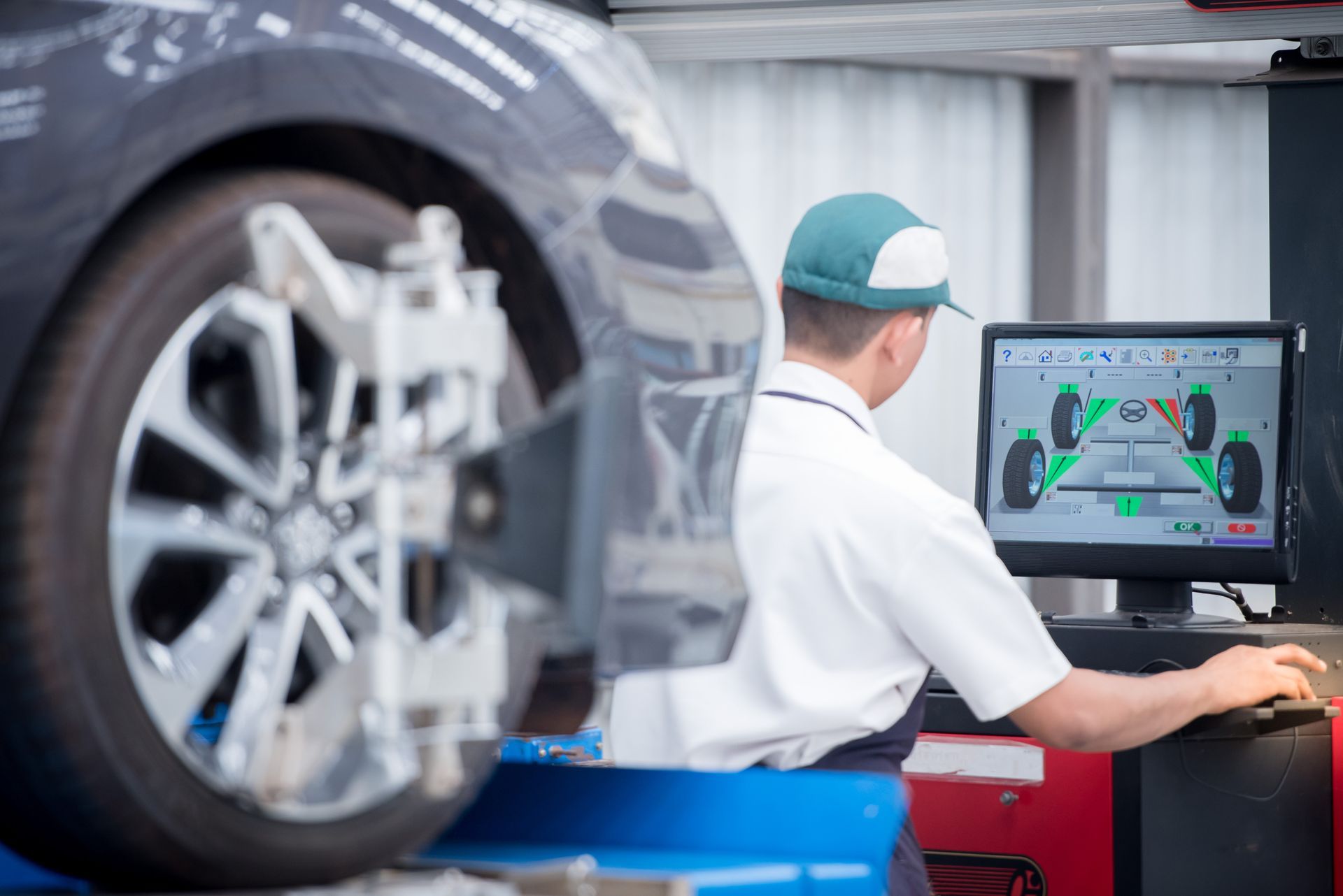 Mechanic aligning wheels | Beer's Automotive Services & Repair