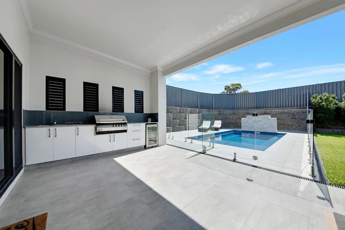 Outdoor Kitchen Area With Swimming Pool — Engineering And Drafting Services In Yeppoon, QLD