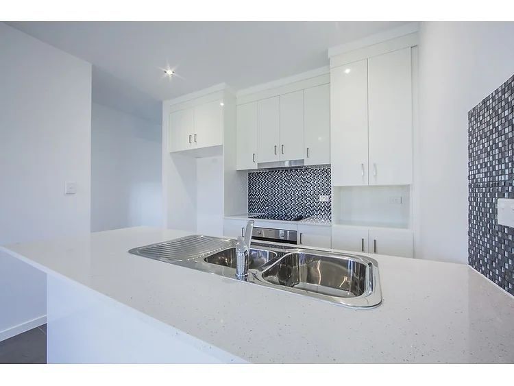 White Kitchen Tops and Cabinets — Engineering And Drafting Services In Yeppoon, QLD