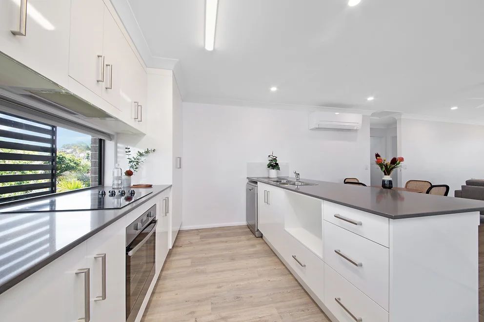White Kitchen With Cabinets — Engineering And Drafting Services In Yeppoon, QLD