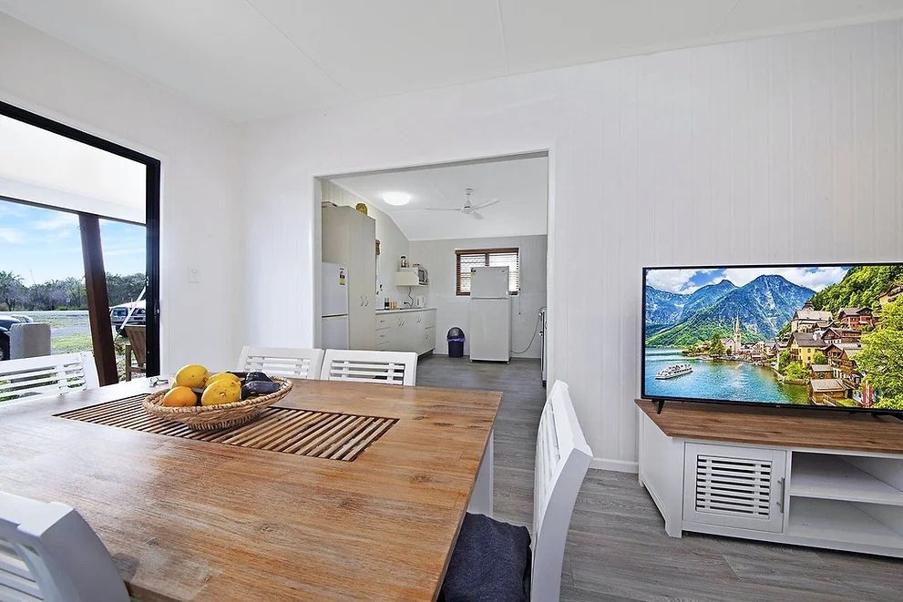 Kitchen Area With Wooden Table — Engineering And Drafting Services In Yeppoon, QLD