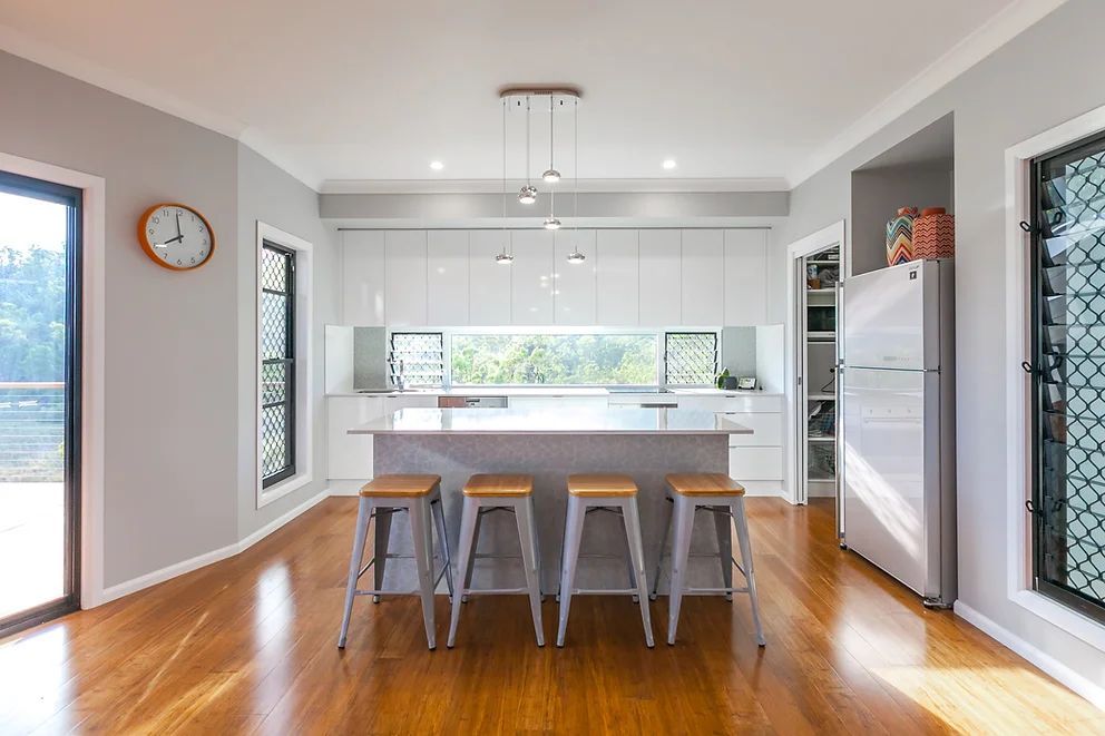 Modern Kitchen Area With Four Stools — Engineering And Drafting Services In Yeppoon, QLD