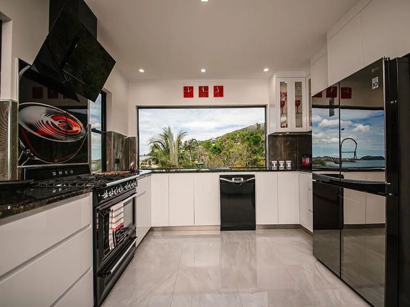 White Kitchen With Black Appliances — Engineering And Drafting Services In Yeppoon, QLD