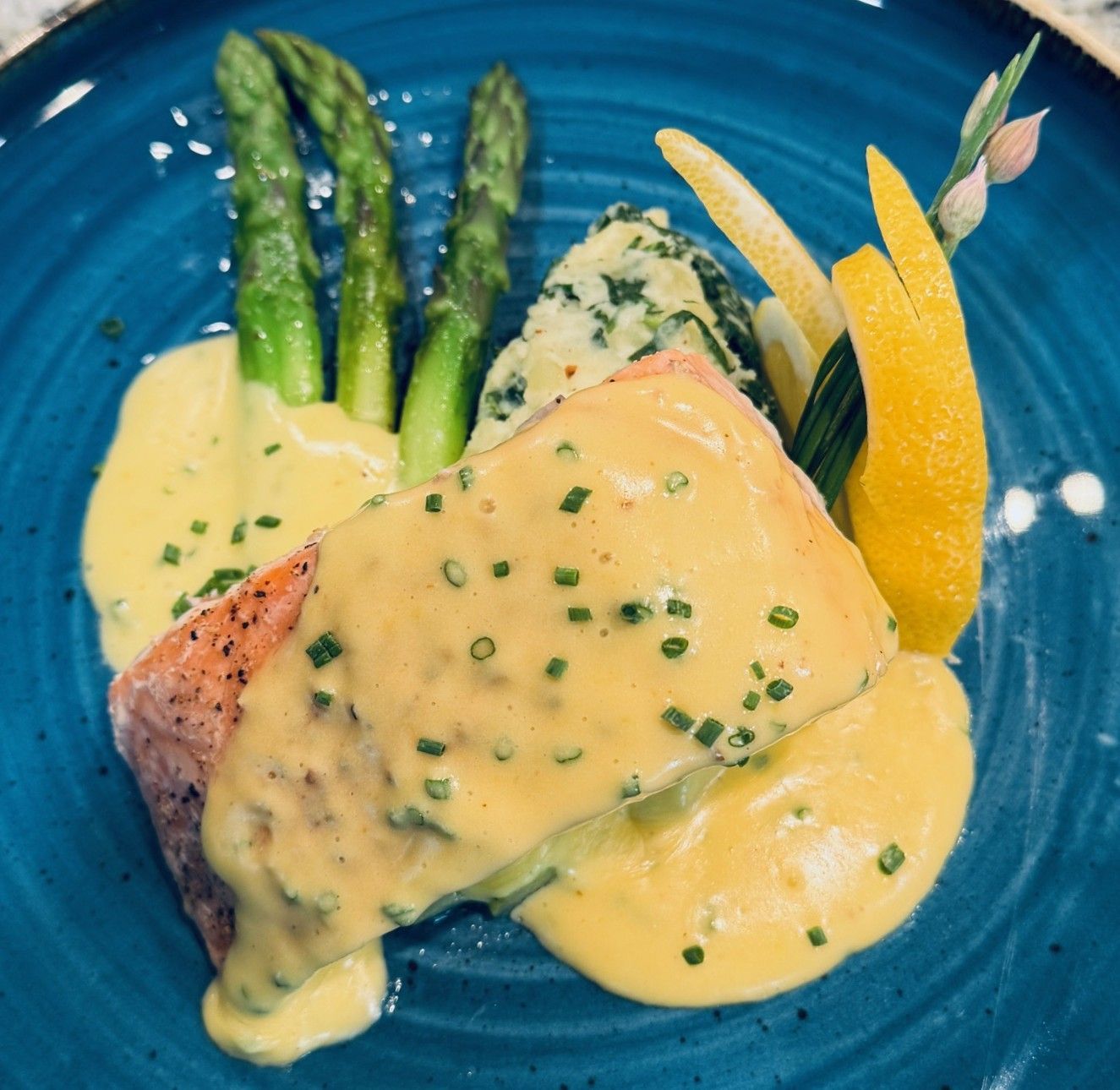Oven poached salmon with asparagus and kale colcannon potatoes with hollandaise