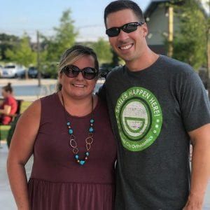 A man and a woman are posing for a picture together.