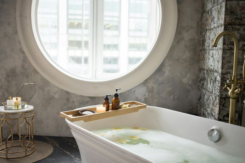 luxurious bathtub in front of window