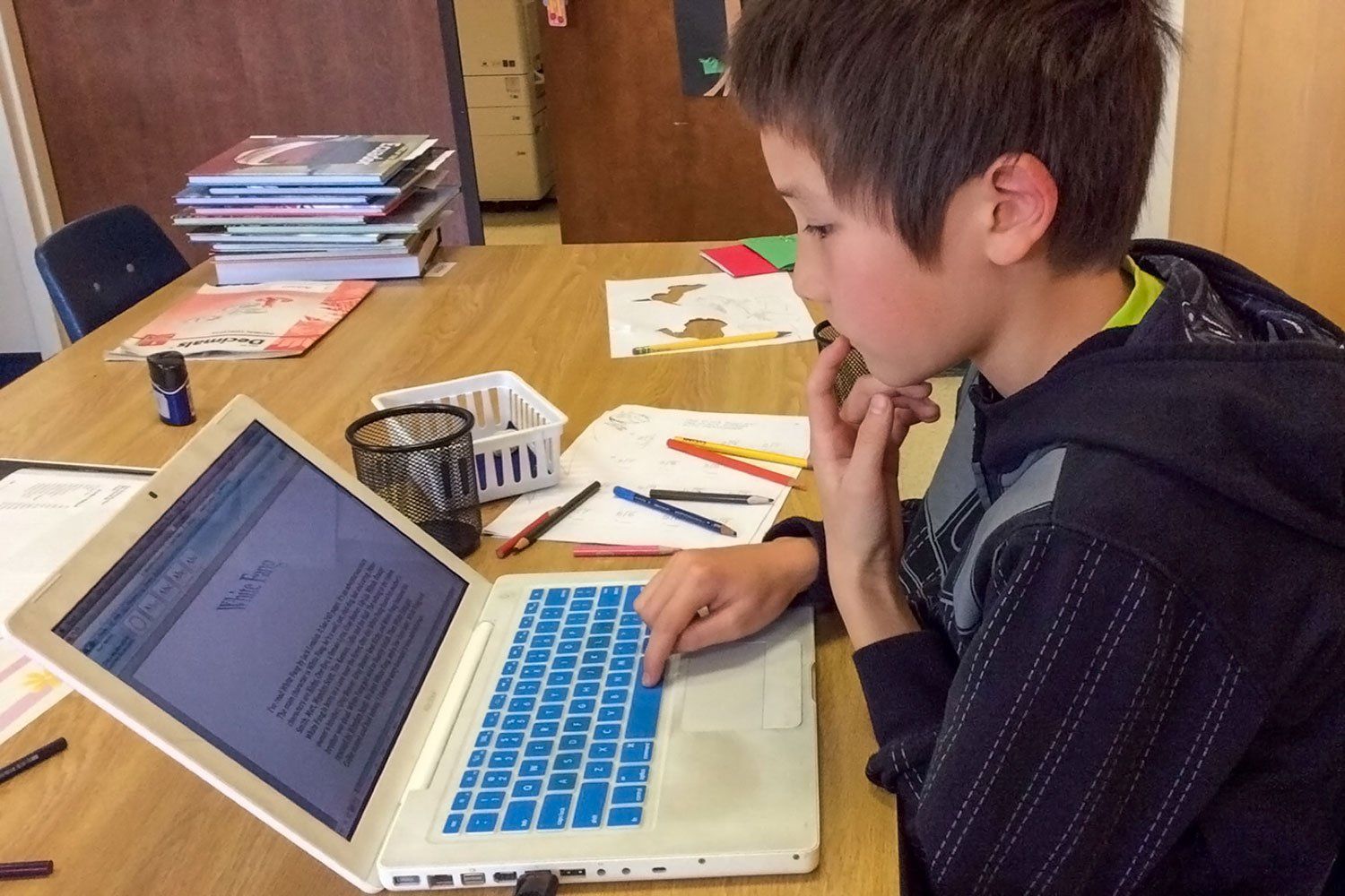 Lower elementary student working on a paper
