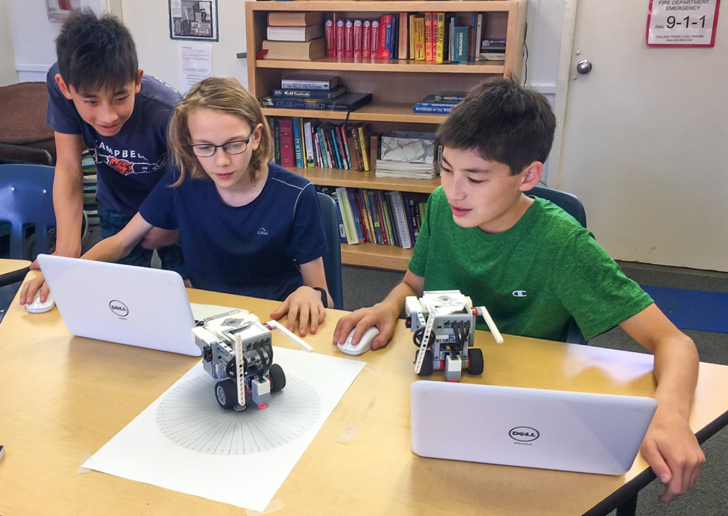 Middle school students working on a robotics project