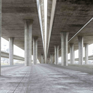 Empty concrete underpass with columns and a wide roadway receding into the distance