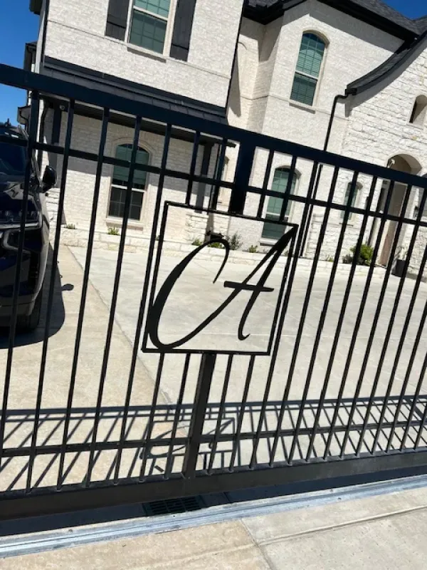 A black fence with the letter a on it